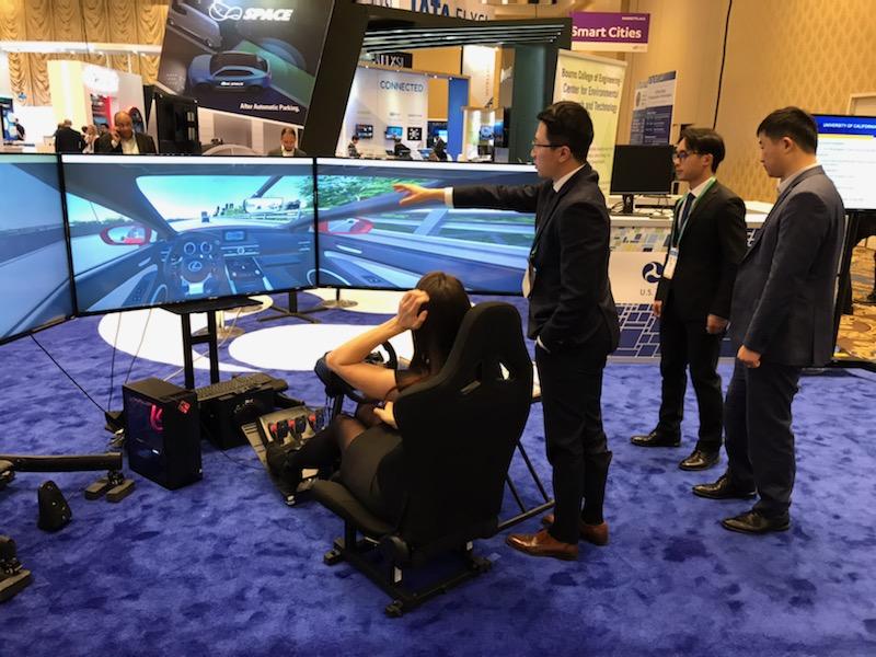 Image of people testing eco-driving simulator at 2020 Consumer Electronics Show