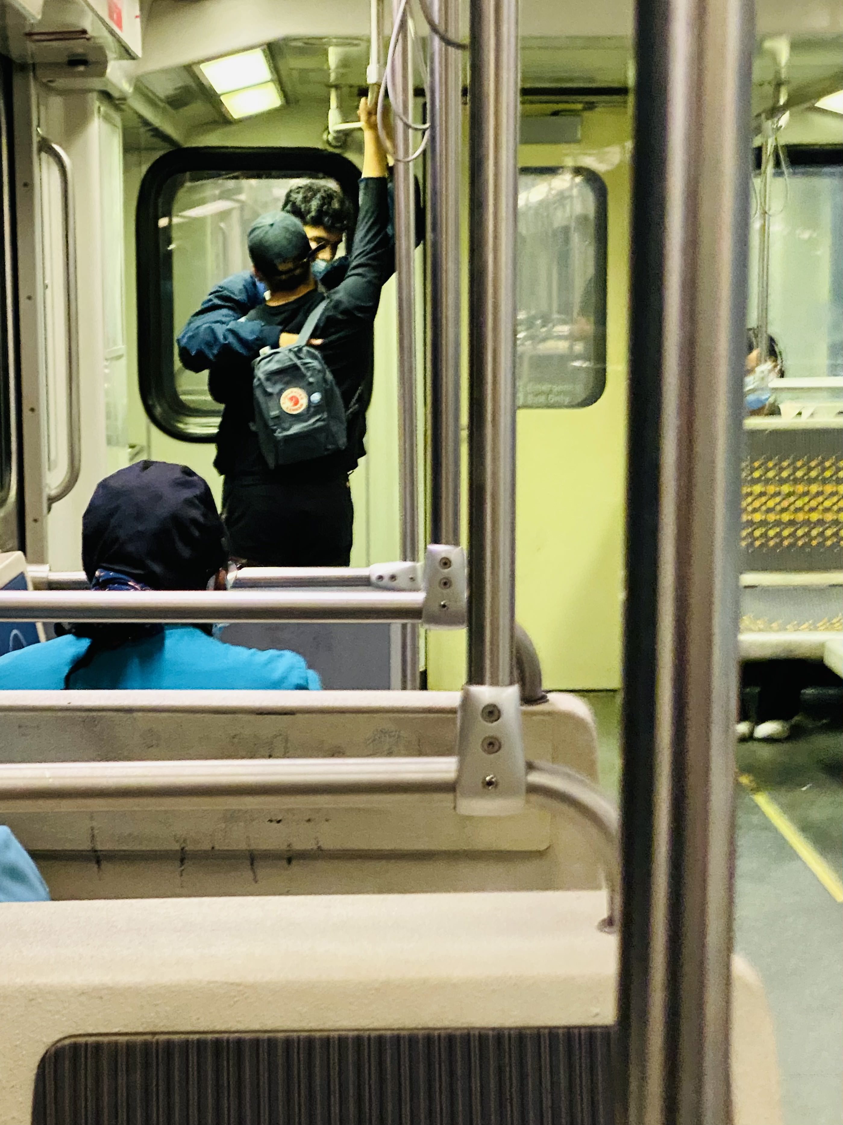 Photo of two people embracing on public transit