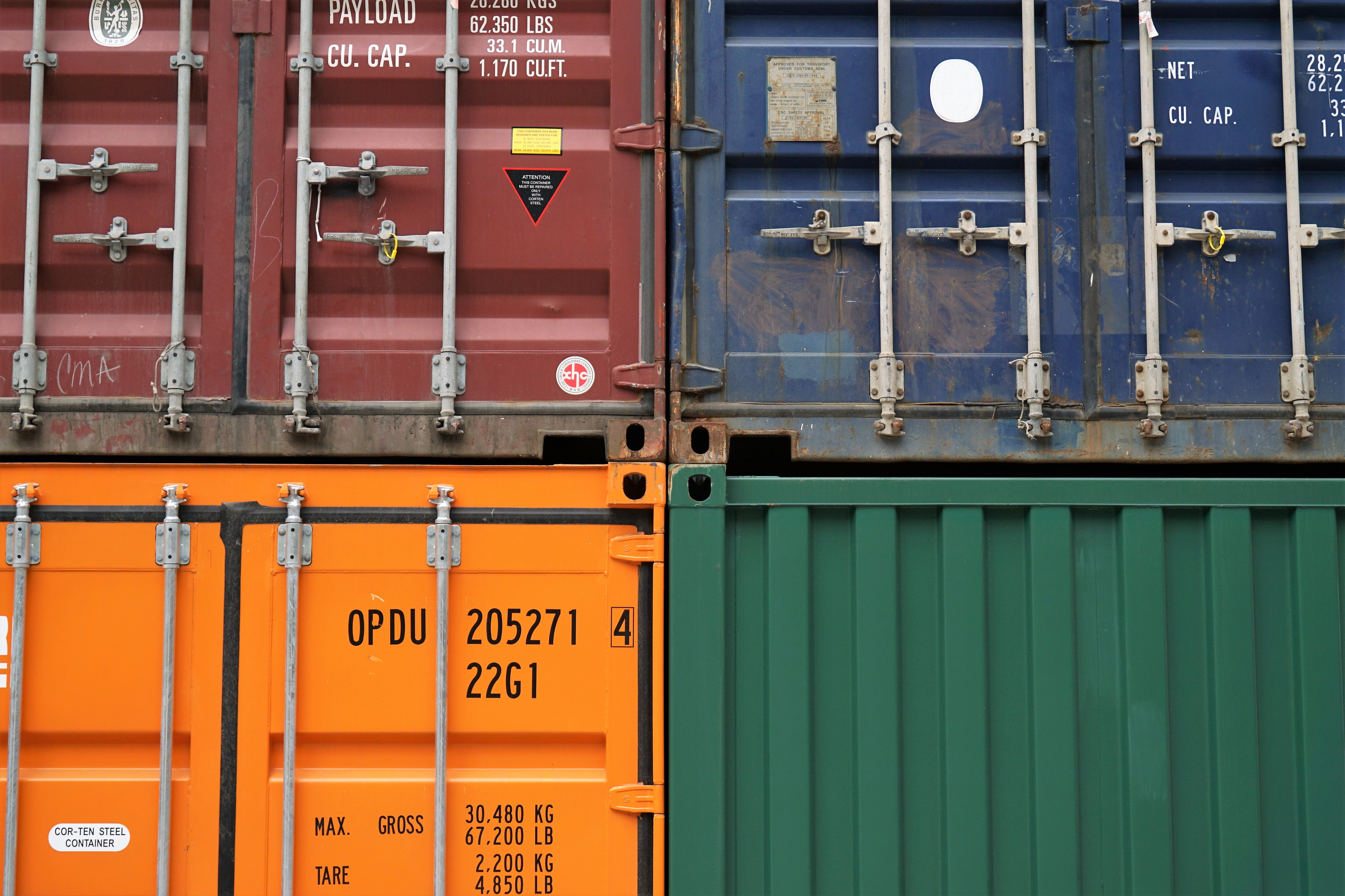 An image of four storage containers stacked on top of each other